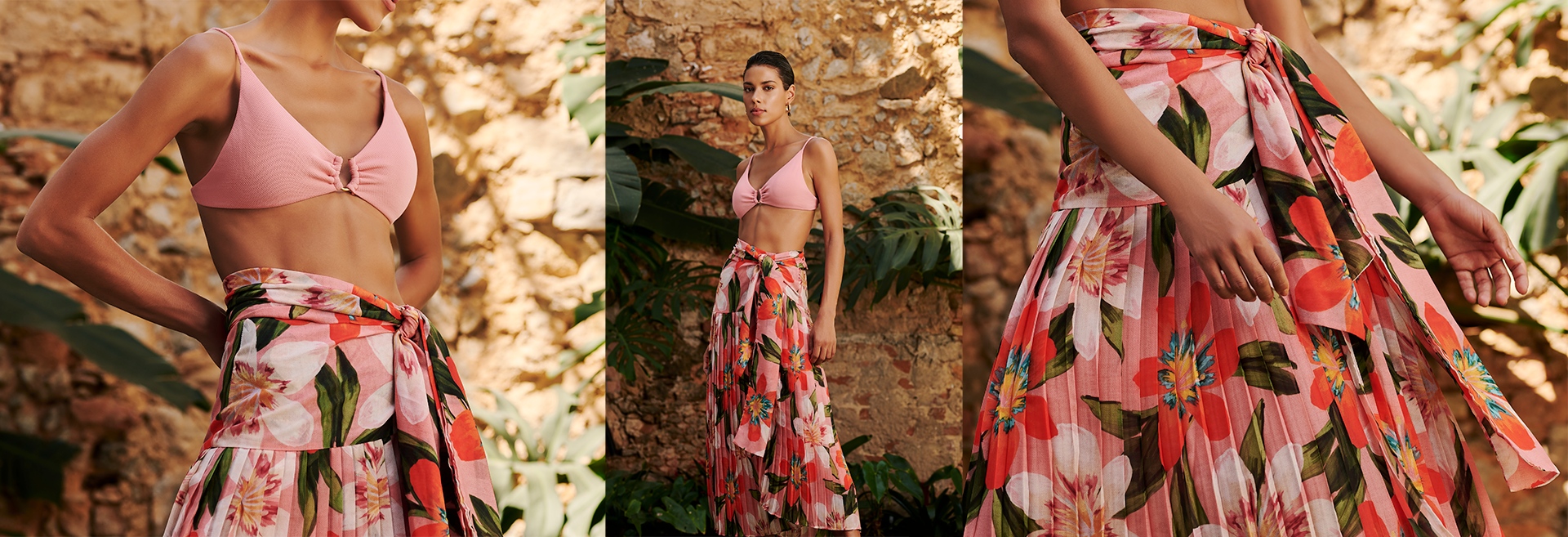 Modelo usando biquíni rosa e saia floral longa
